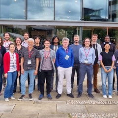 ICCS staff standing outside the Centre for Mathematical Sciences