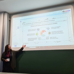 2025 ICCS intern Alison Spadaro gives a presentation in front of a big screen